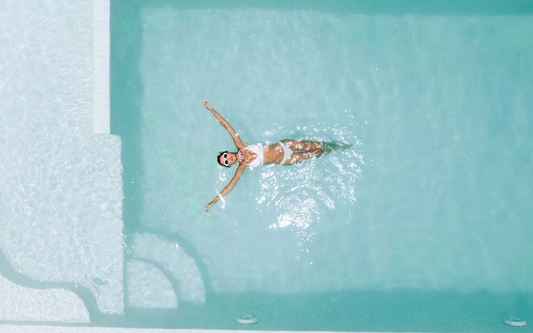 Women floating in pool
